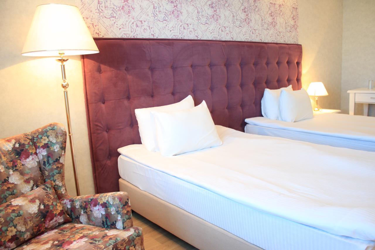 Akbulak Hotel Astana Bagian luar foto