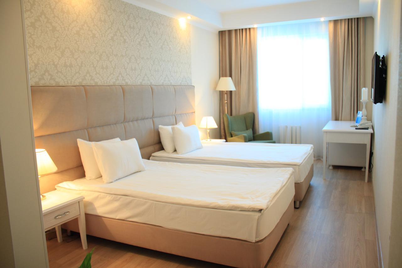 Akbulak Hotel Astana Bagian luar foto