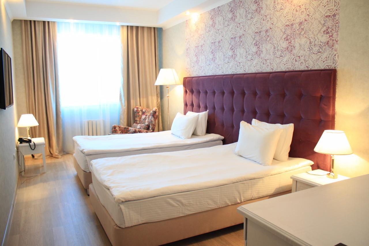 Akbulak Hotel Astana Bagian luar foto