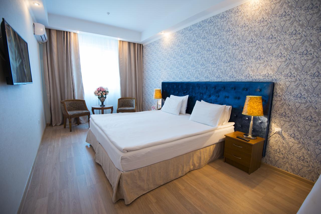 Akbulak Hotel Astana Bagian luar foto